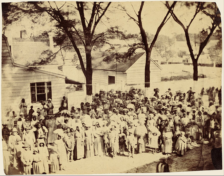 Southern civilians with their slaves in line to receive rations from the Union Army during the Civil War in Beaufort, South Carolina.